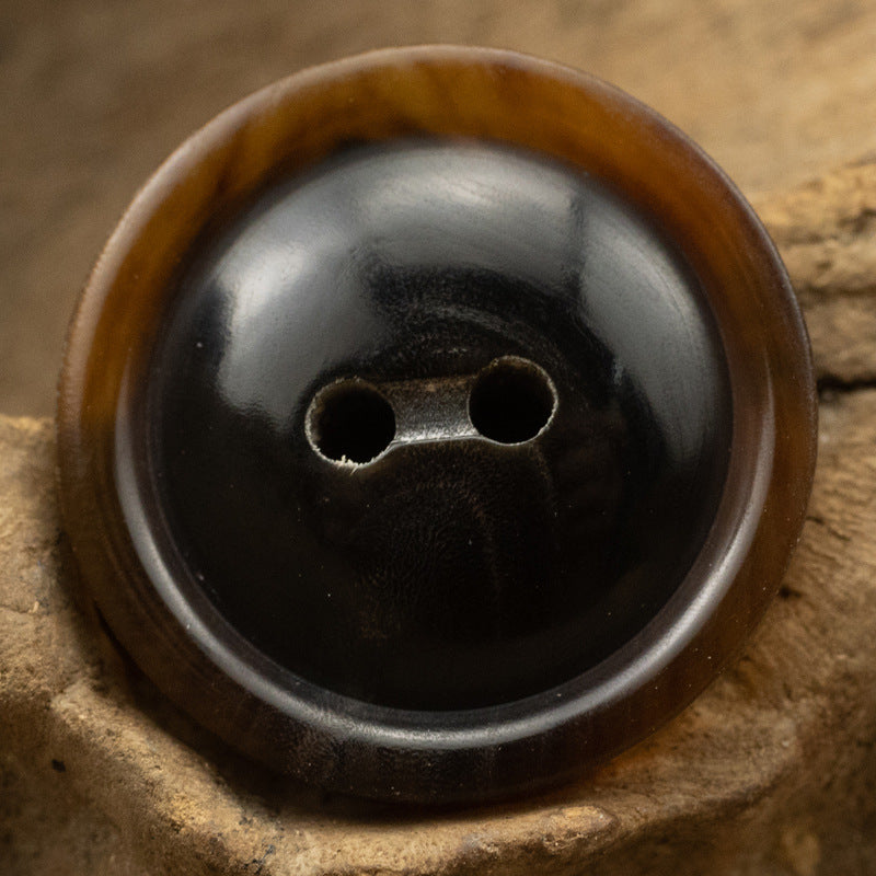 Coffee horn button with two holes, close-up