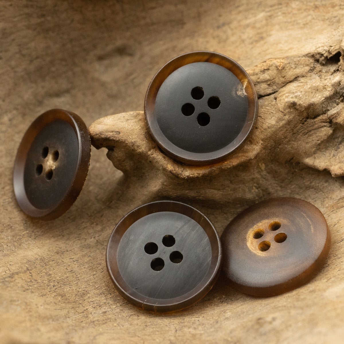 Dark brown horn buttons, assorted faces with 4- and 5-hole patterns