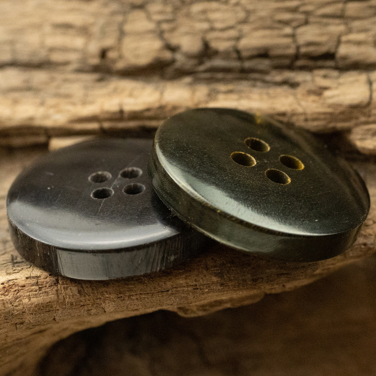 Frosted horn buttons in Silver Gray and Ginger Yellow on a leather strap