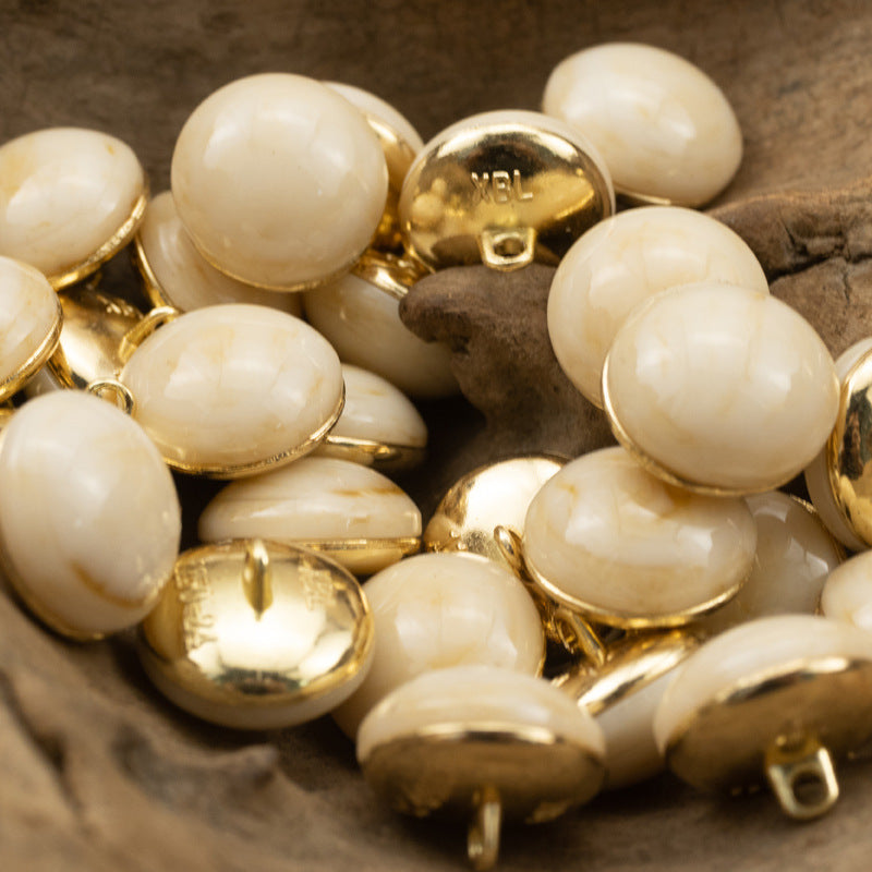 More pearl white round cheongsam buttons with gold shanks and glossy stone-look fronts