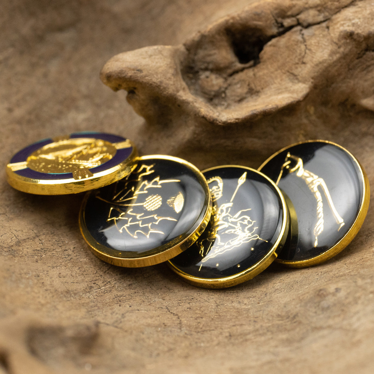 Metal shank buttons with gold engravings and dotted gold trim; glossy dark and light faces