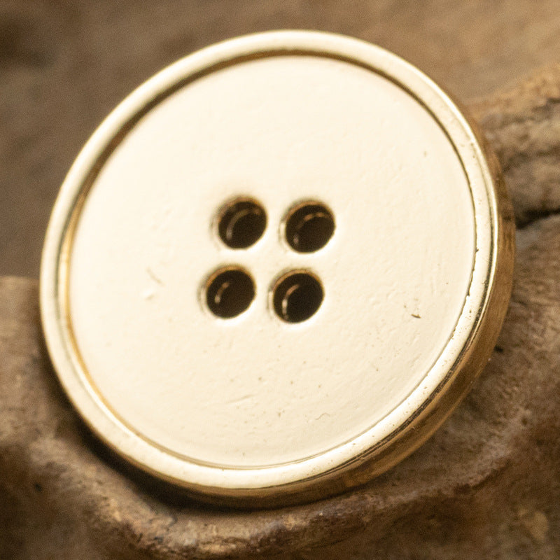 Round 4-hole metal button with pale silver face and four dark holes, zinc alloy