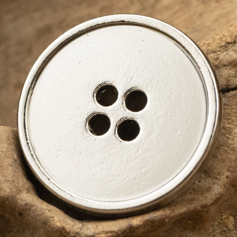 Round 4-hole metal button, bright silver finish with four dark holes