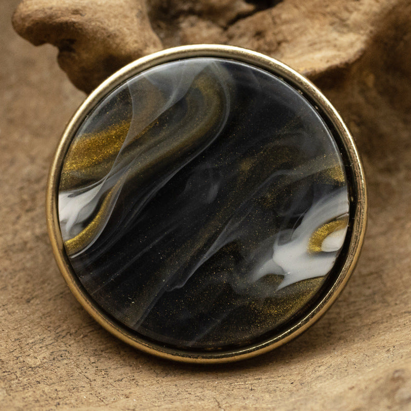 Runder Glasknopf mit Metallschaft, schwarz mit goldenen Glitzerstreifen