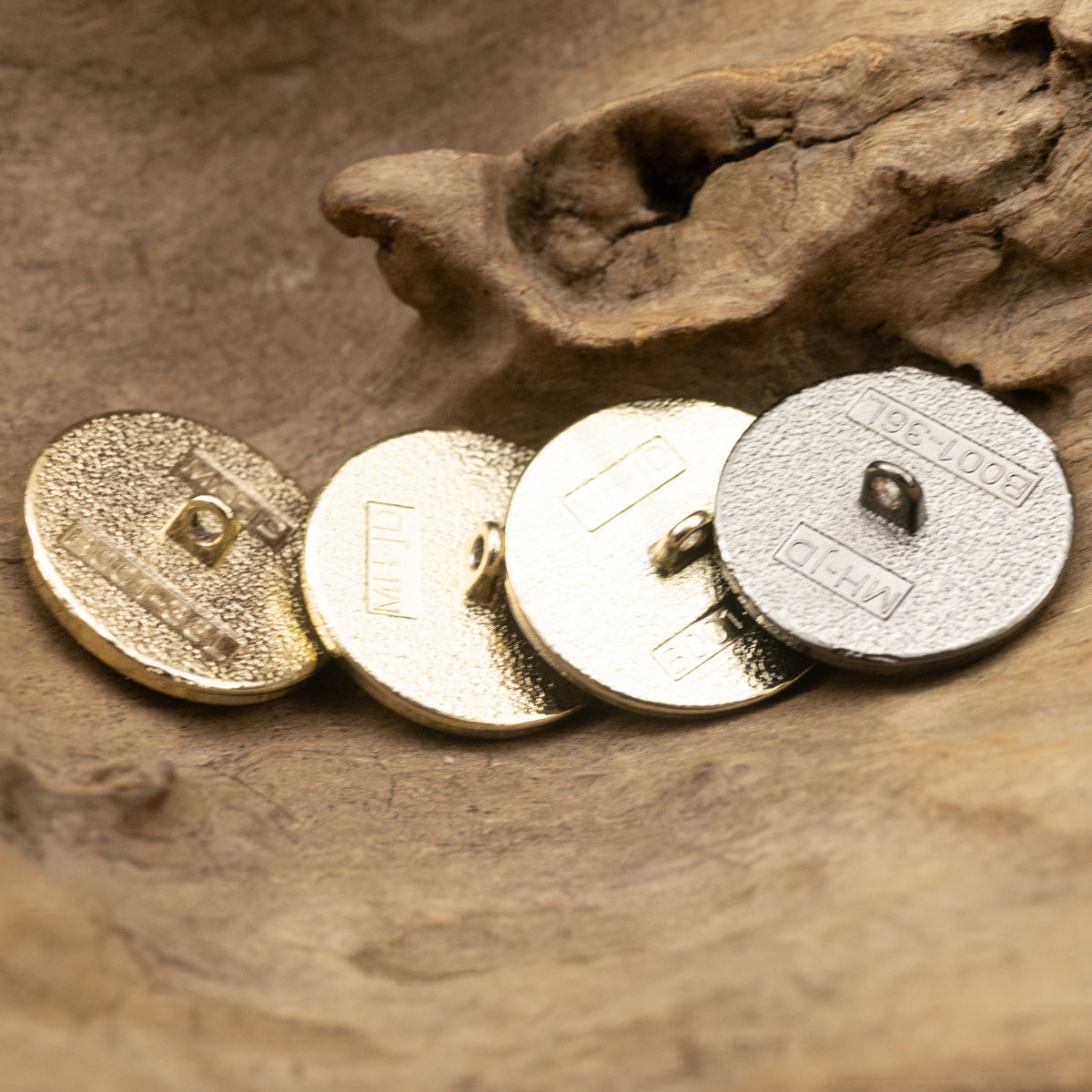 Round resin-faced buttons, metal backs with shanks and holes, pearl-lustre finish