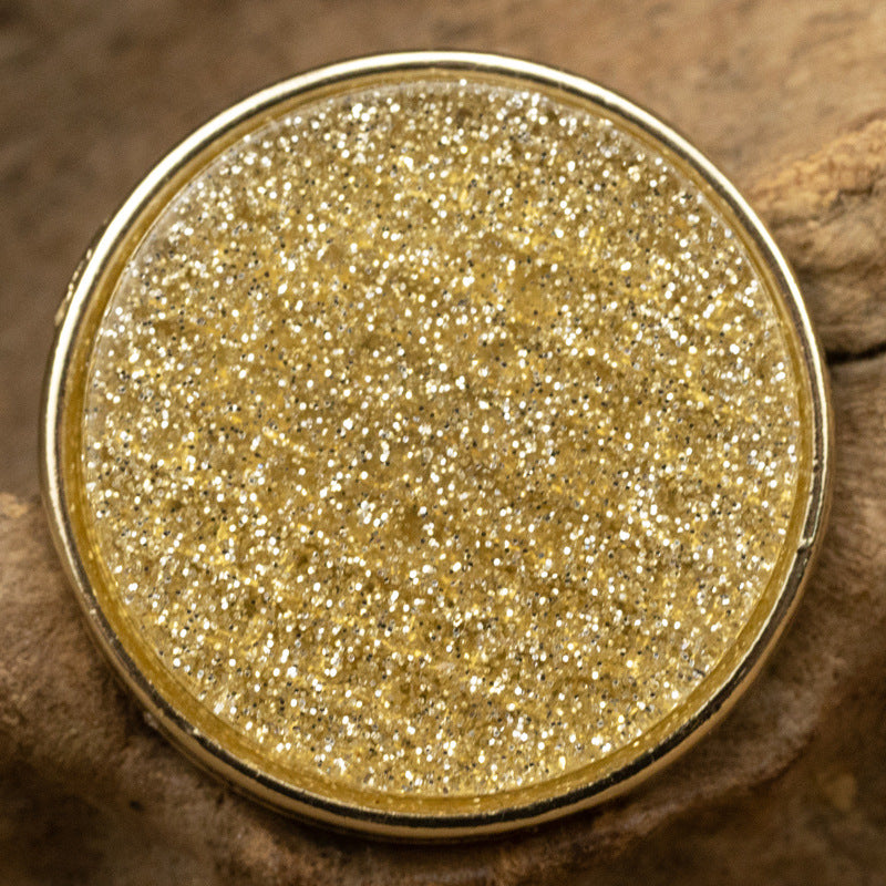 Round resin-faced metal button, gold glitter pearl-lustre top, shiny metal rim
