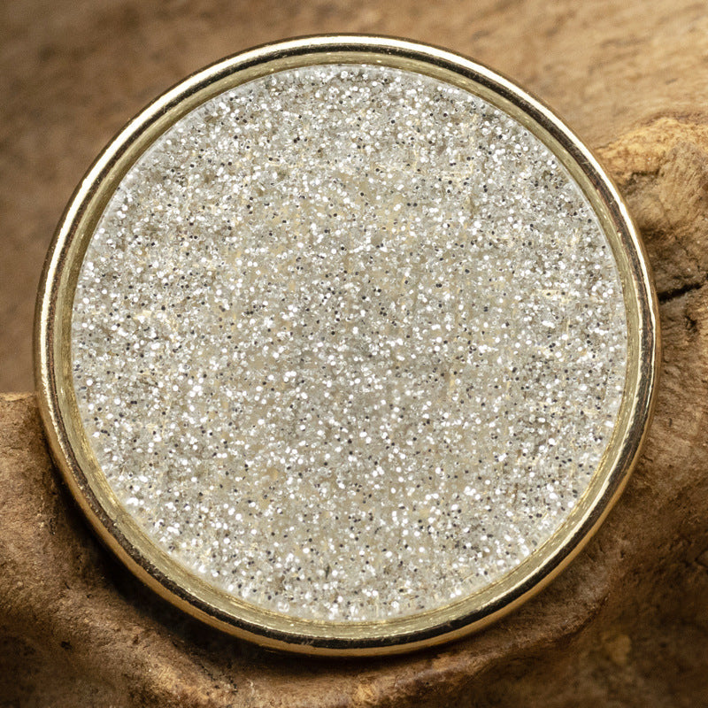 Round resin-faced metal button, silver glitter pearl-lustre top with gold-toned rim
