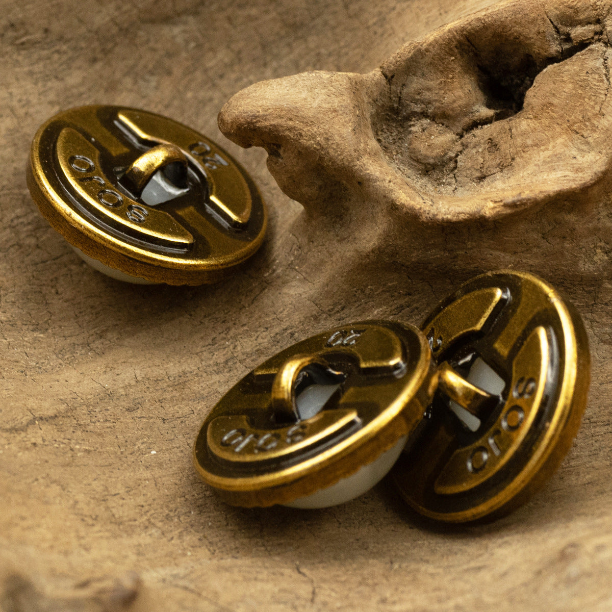 Bronze metal shank button backs with engraved pattern and central pearl opening