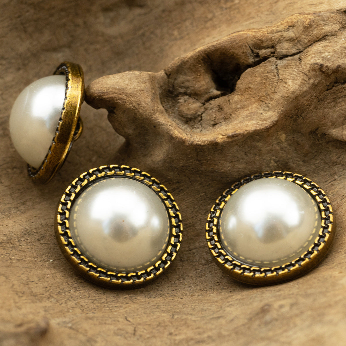 Pearl button set with bronze twisted-lace edge and metal shank backing