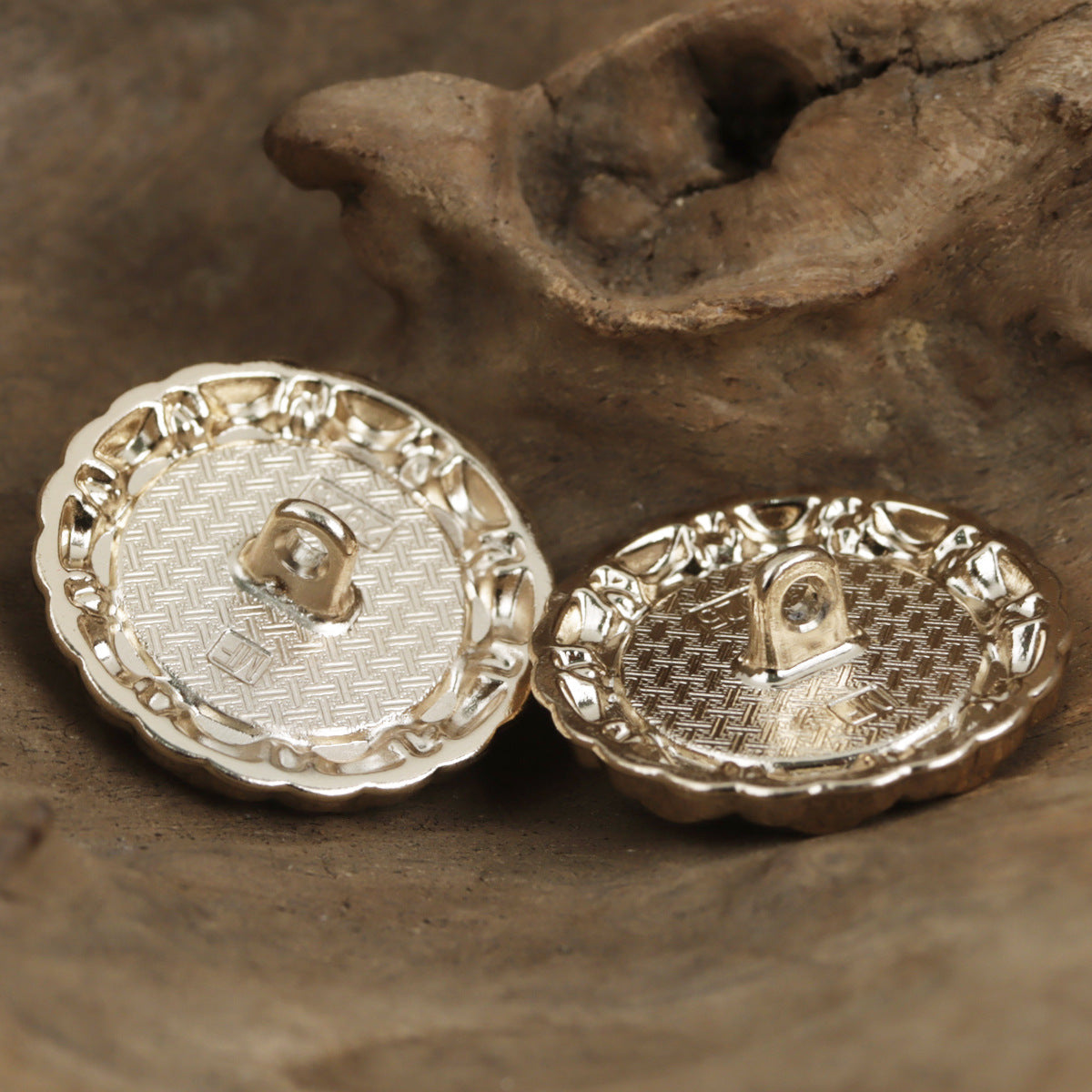 Cat's eye lace buttons, metal backs with textured disc and loop shank