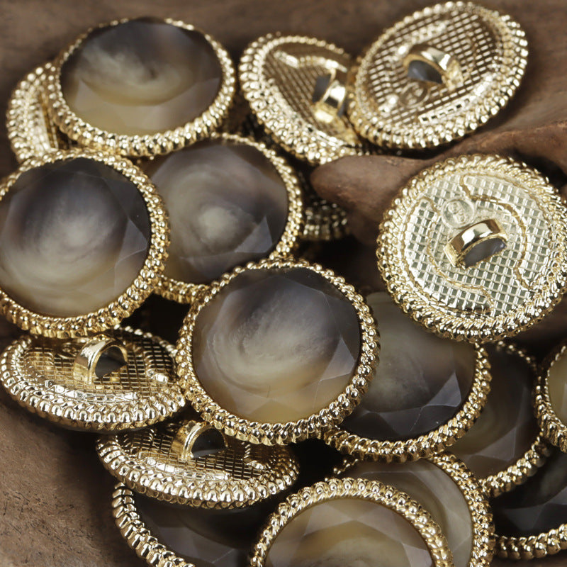 18–23mm black resin button with gold lace-style metal rim and metal loop shank