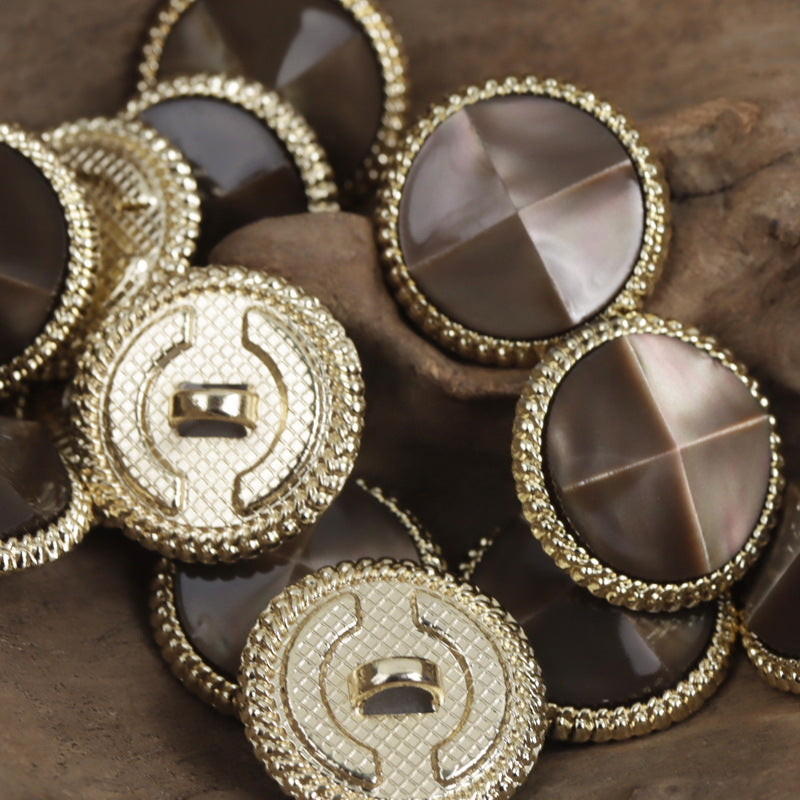 Dark brown resin tortoise-shell buttons, gold metal bases, faceted center