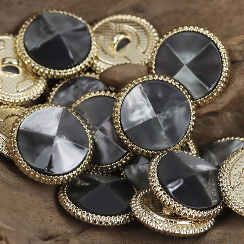 Black resin tortoise-shell buttons, gold metal bases, glossy faceted round face