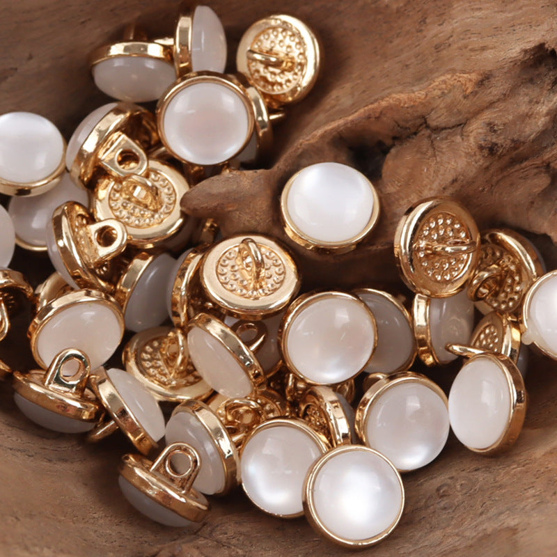 12.5mm white resin buttons with gold-tone loop shanks, round, embossed detail