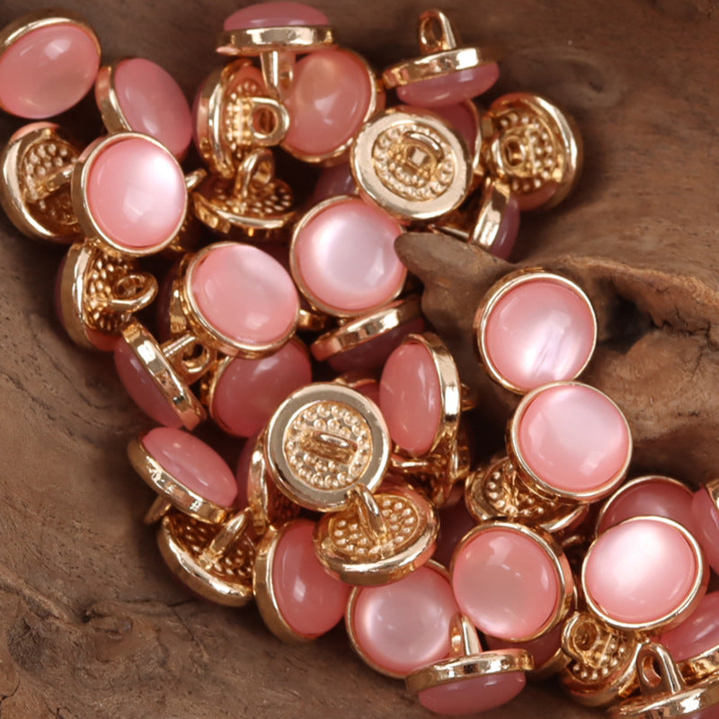12.5mm pink resin buttons with gold-tone loop shanks, round, embossed detail