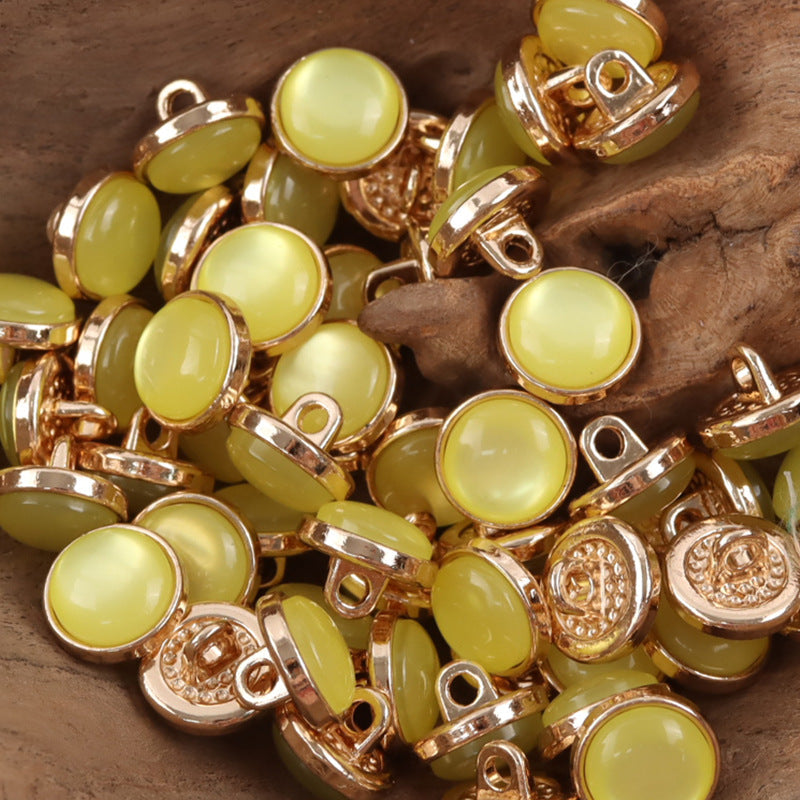 12.5mm yellow resin buttons with gold-tone loop shanks, round, embossed detail