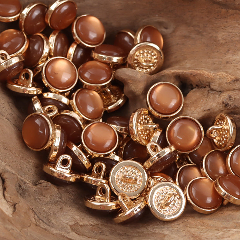 12.5mm brown resin buttons with gold-tone loop shanks, round, embossed detail