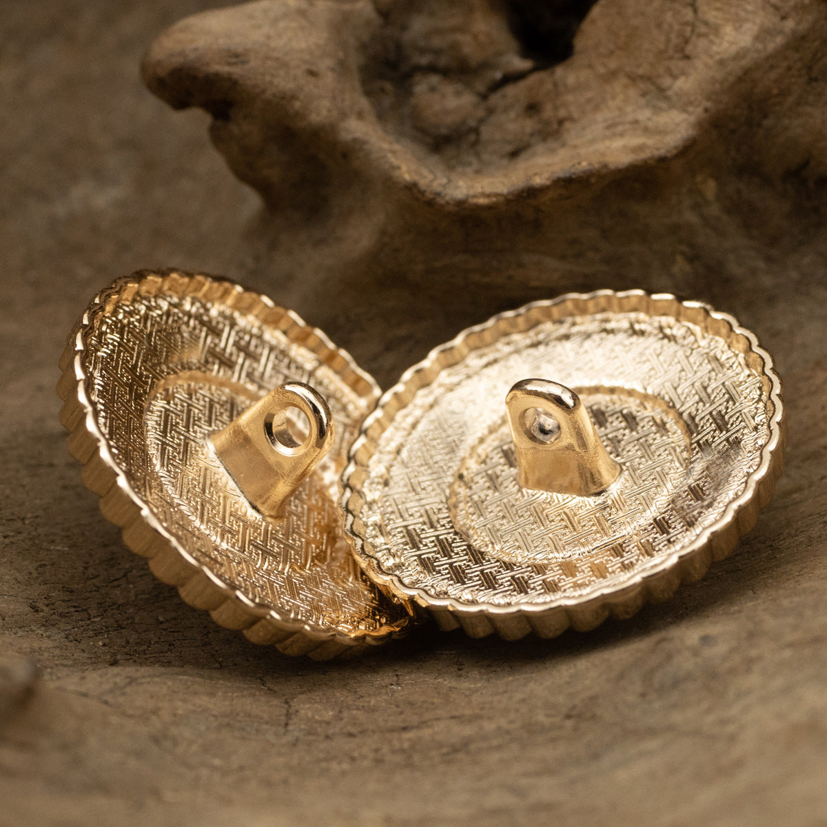 Pearl metal coat button pair, gold-tone rim with shank backs