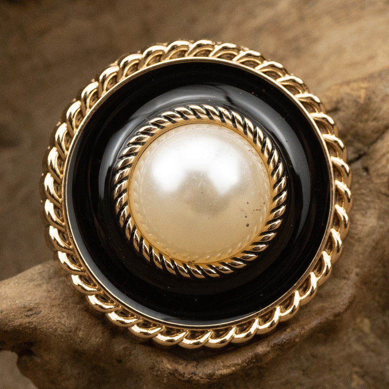 Vintage pearl metal button, black enamel center, gold-tone scalloped edge