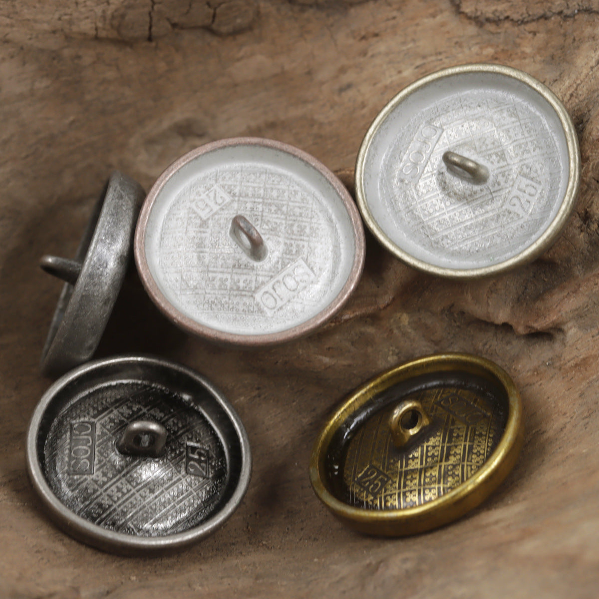 Antique metal shank button backs with stamped pattern, silver and black nickel tones