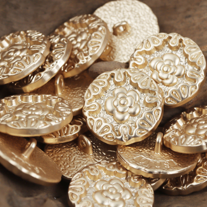 Set of gold metal buttons with embossed rose motif and central shank, 10pcs