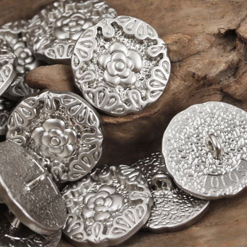 Set of silver metal buttons with embossed rose motif and central shank, 10pcs