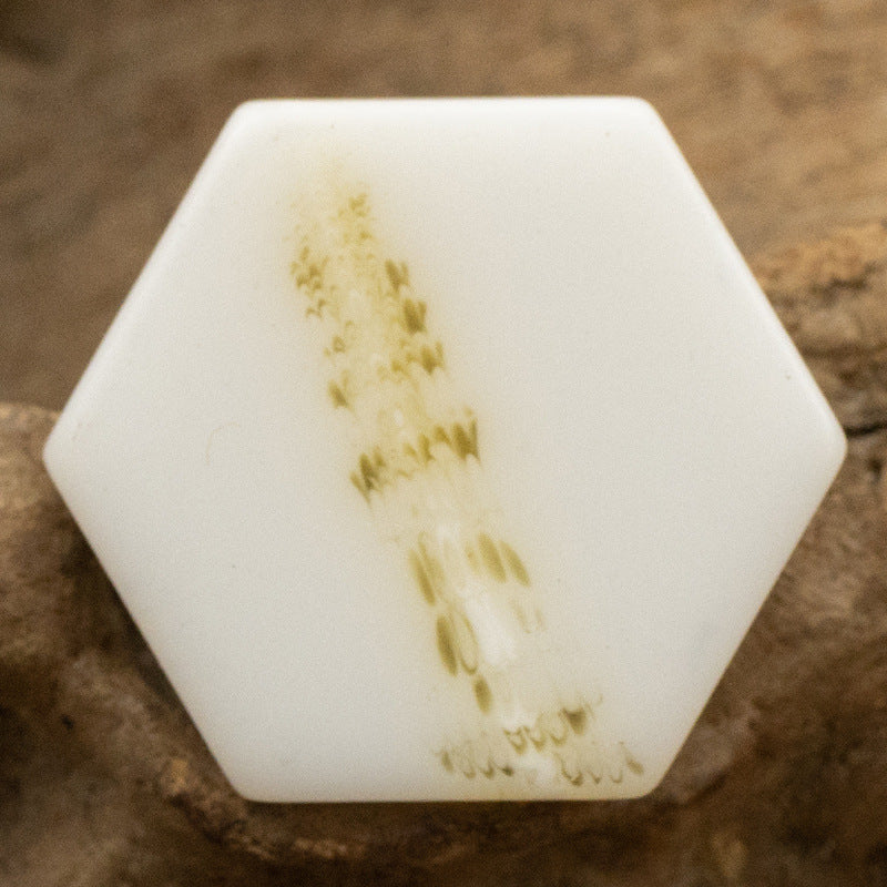 White hexagonal resin shank button, yellow marble texture with speckles