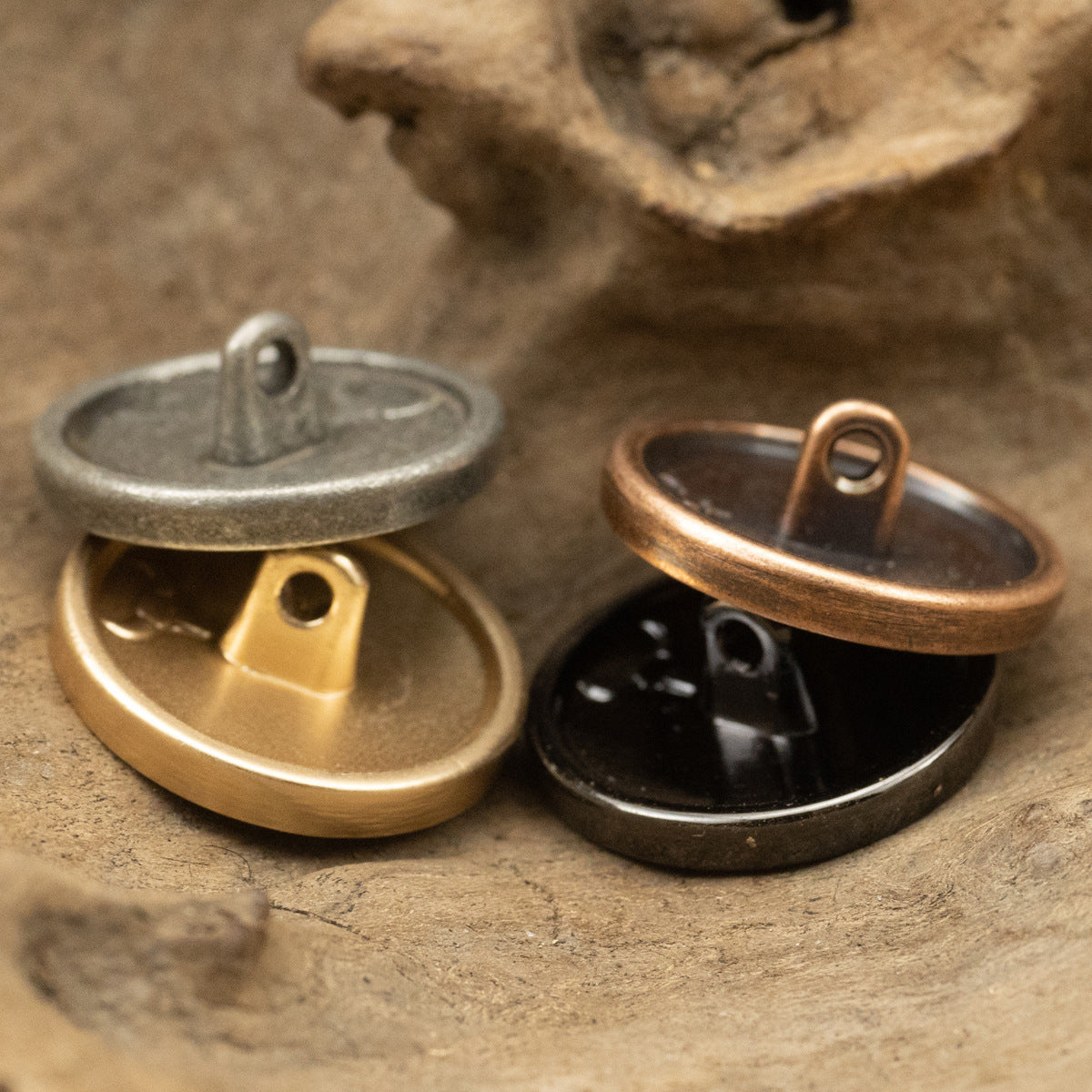 Metal anchor buttons backs with loop shanks, showing gold and black options