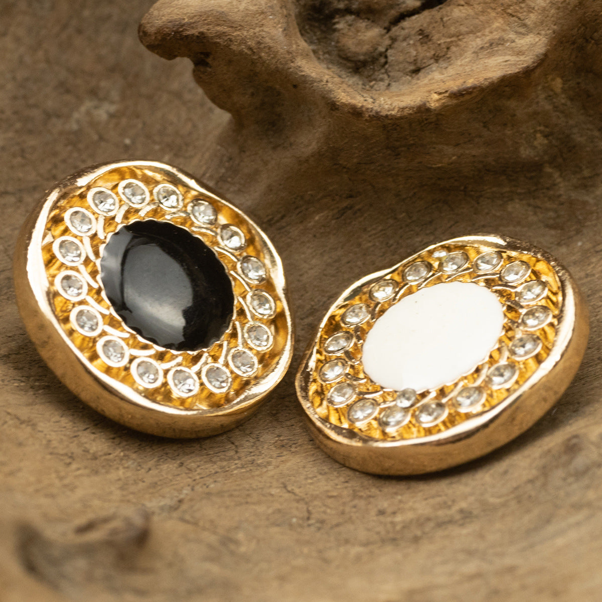 Rhinestone-ring jacket buttons: black center left, white center right