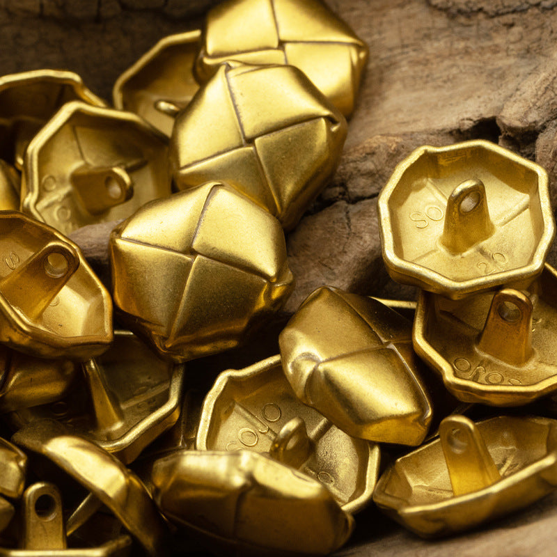 Beret-shaped gold lacquered metal buttons with cross-pattern face and loop shank backs