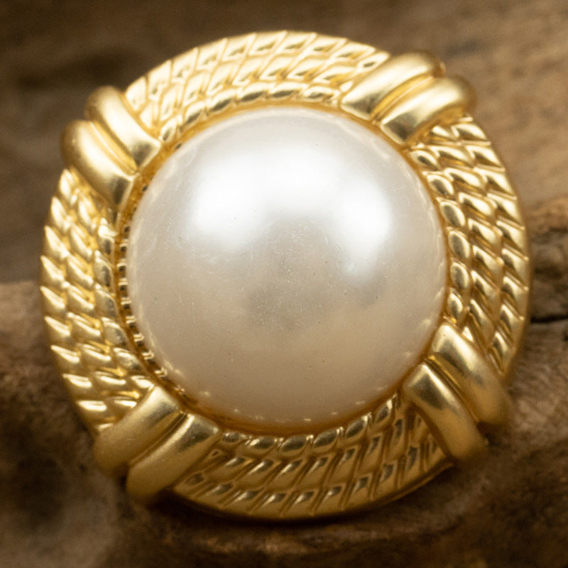 25mm gold-tone pearl metal button with braided rim and central misty white pearl