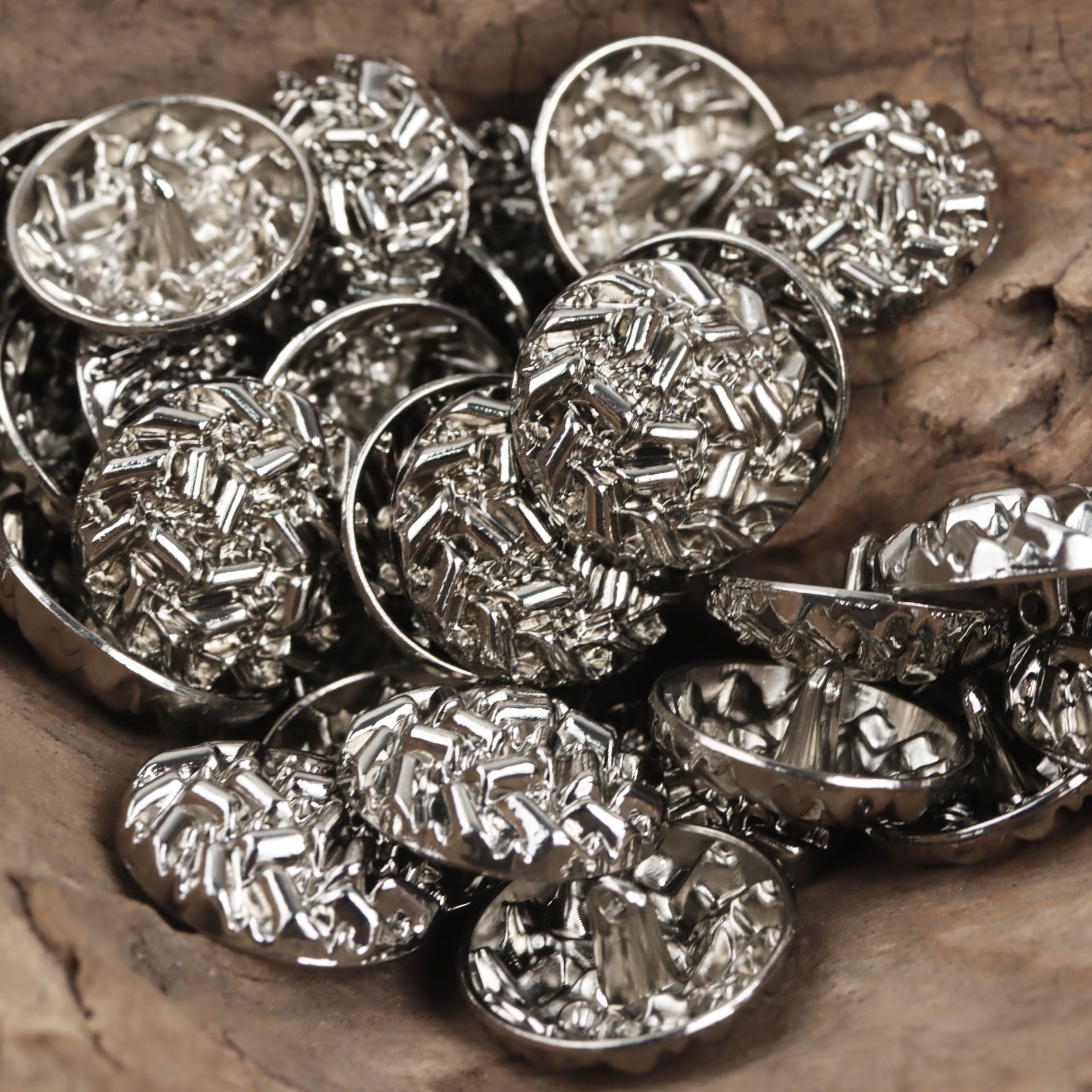 Silver 20–25 mm abstract metal buttons with loop shank, multiple pieces