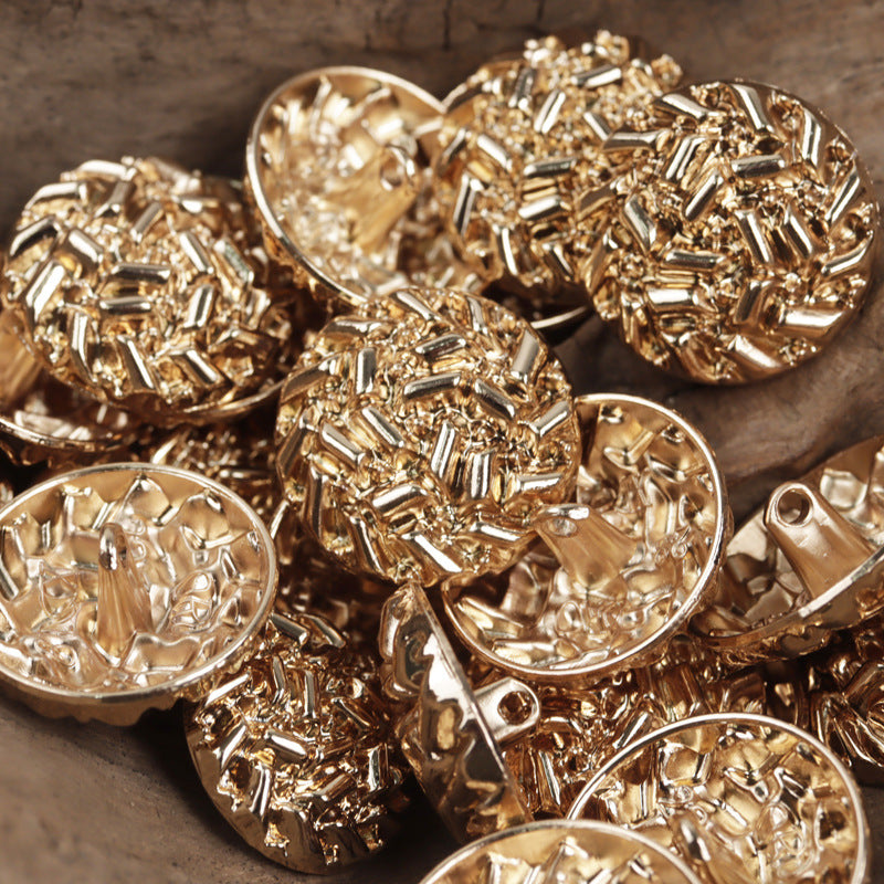 Gold 20–25 mm abstract metal buttons with loop shank, multiple pieces