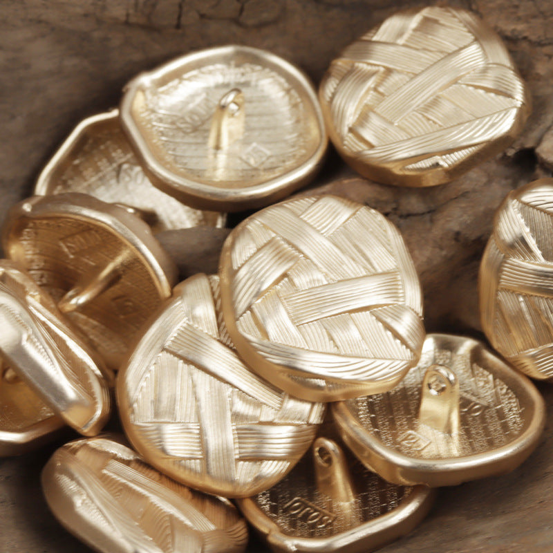 Gold-toned metal buttons with irregular woven pattern and shank, round