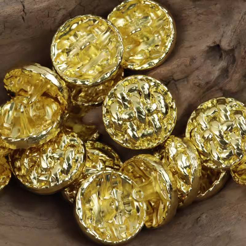 Assorted gold-tone twisted braided metal buttons, round hammered texture