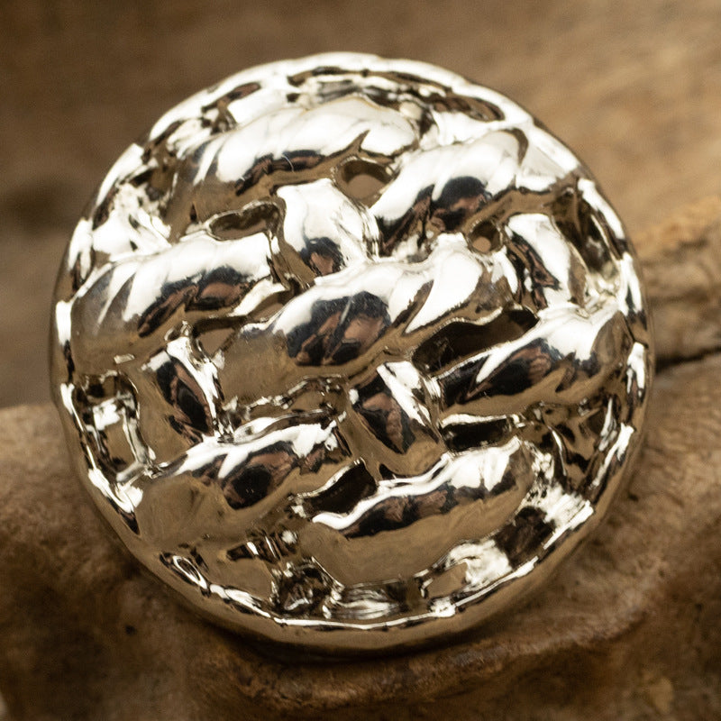 Silver twisted braided metal button, round hammered finish, visible shank backing