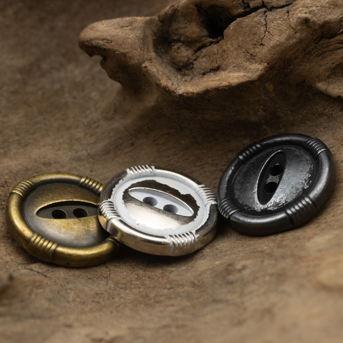 Assorted cat’s eye metal buttons: bronze, white silver, and black nickel, 2-hole front