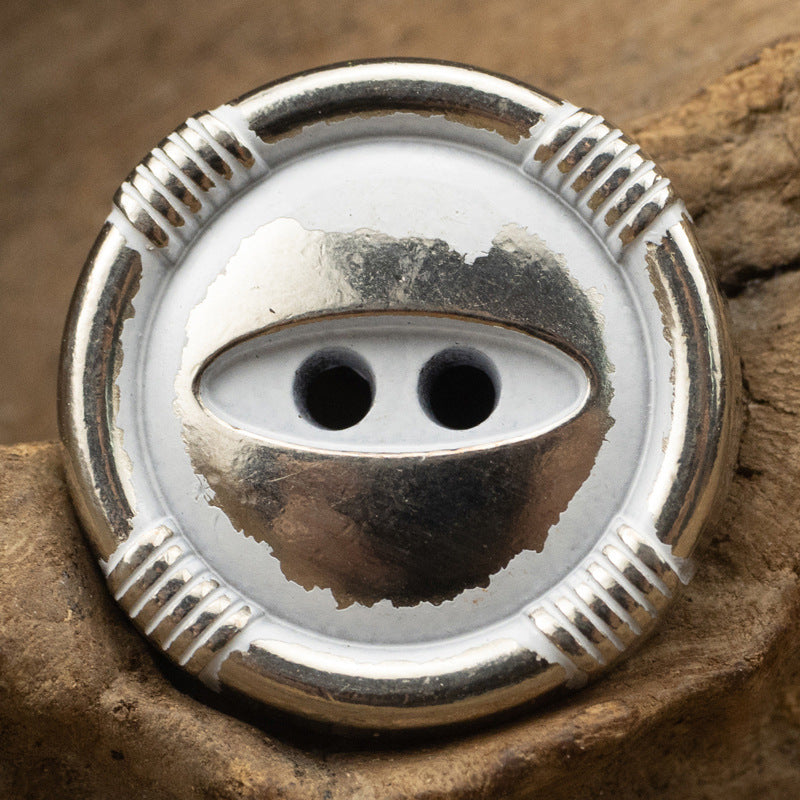 White silver cat’s eye metal button with ridged edge and 2-hole shank