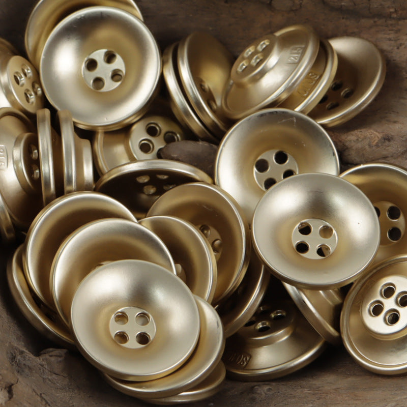 Bronze-toned bowl-shaped metal buttons with 4-hole design, polished round faces