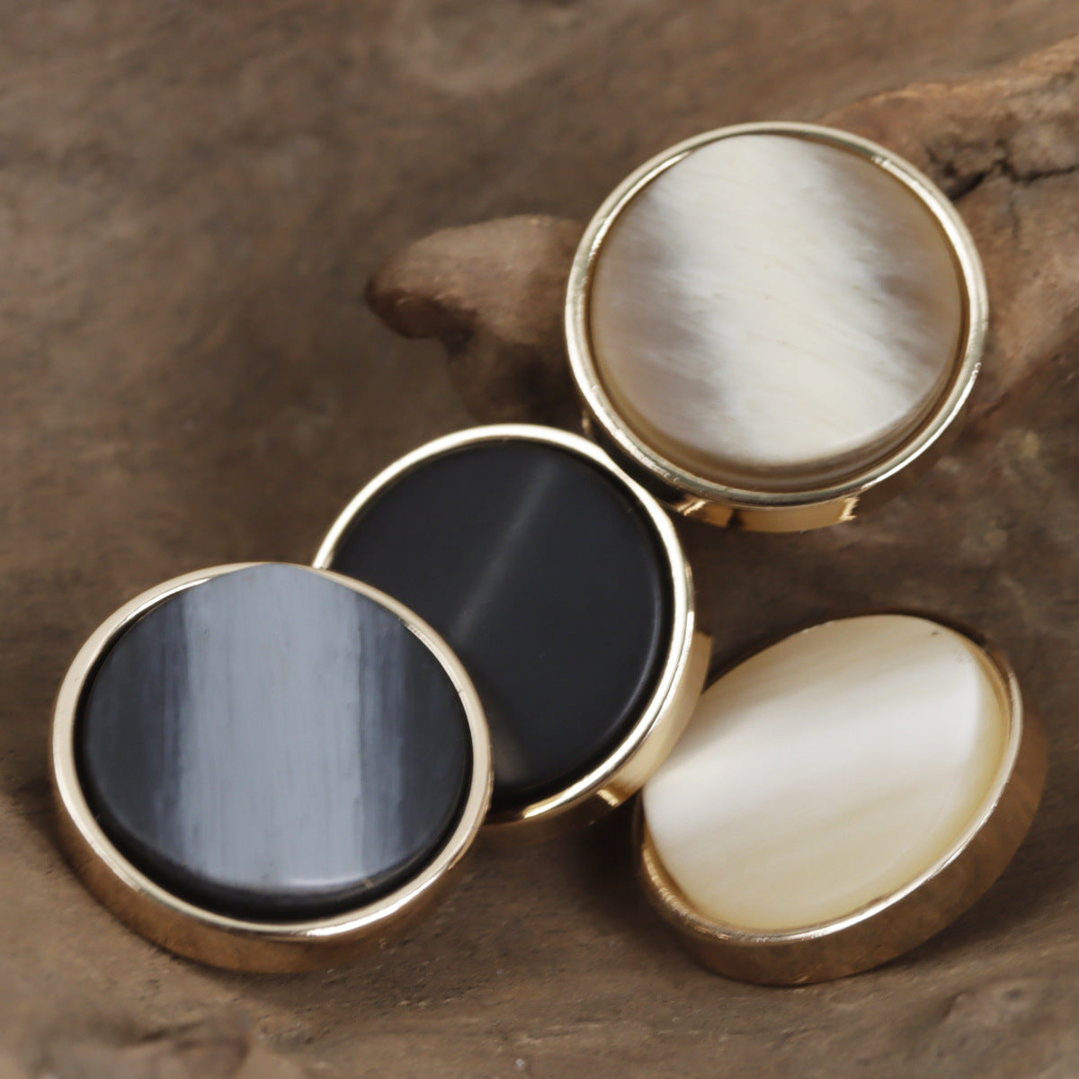 Gold-tone base shank buttons in beige, coffee, deep gray, and black—round front set