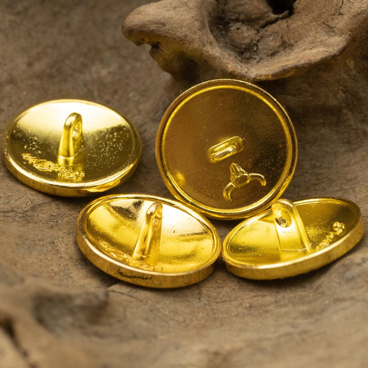 Gold metal shank buttons with domed fronts and visible posts, 6pcs