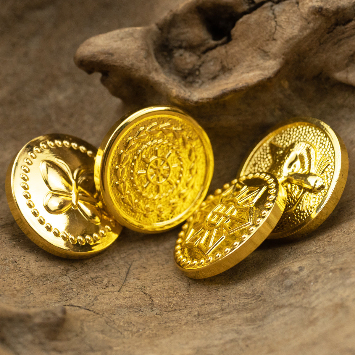 Gold metal shank buttons with butterfly and fanlike emblem fronts, 6pcs