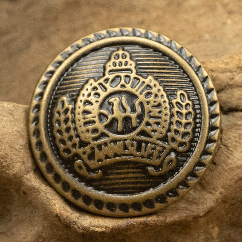 Round antique bronze brass button with striped crest, crown at top