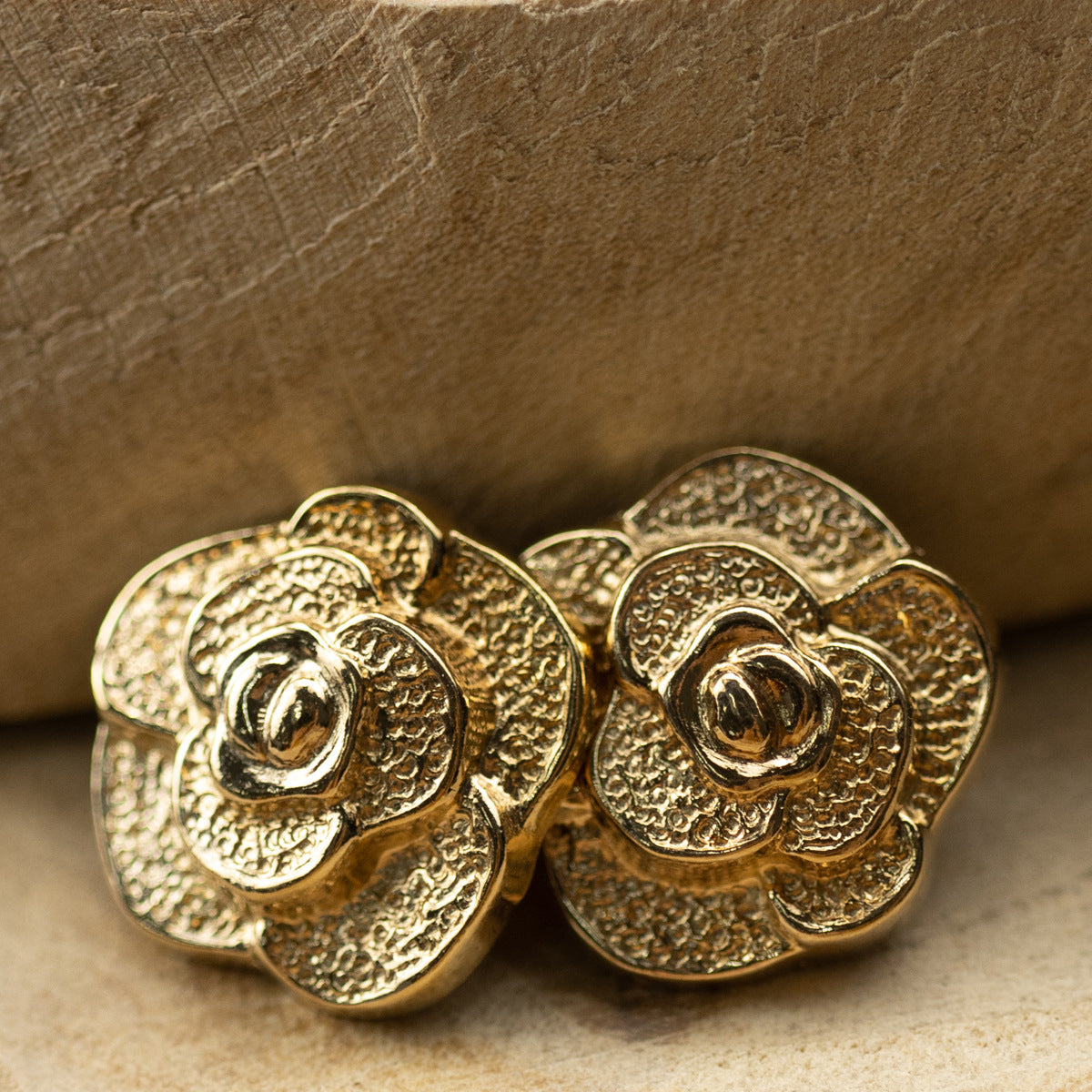 Set of two gold rose metal buttons, embossed petals with reflective center