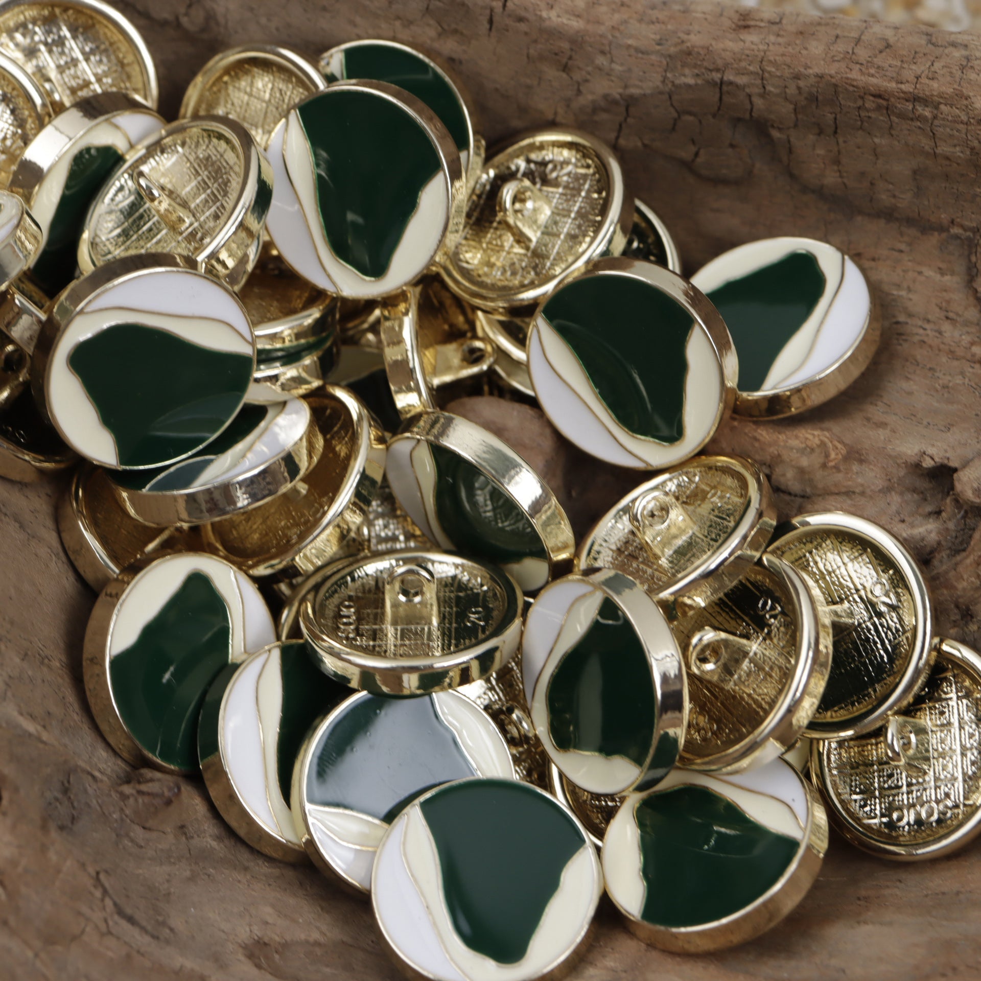 Assorted oil-paint style button fronts, green-and-white enamel with gold-toned rims