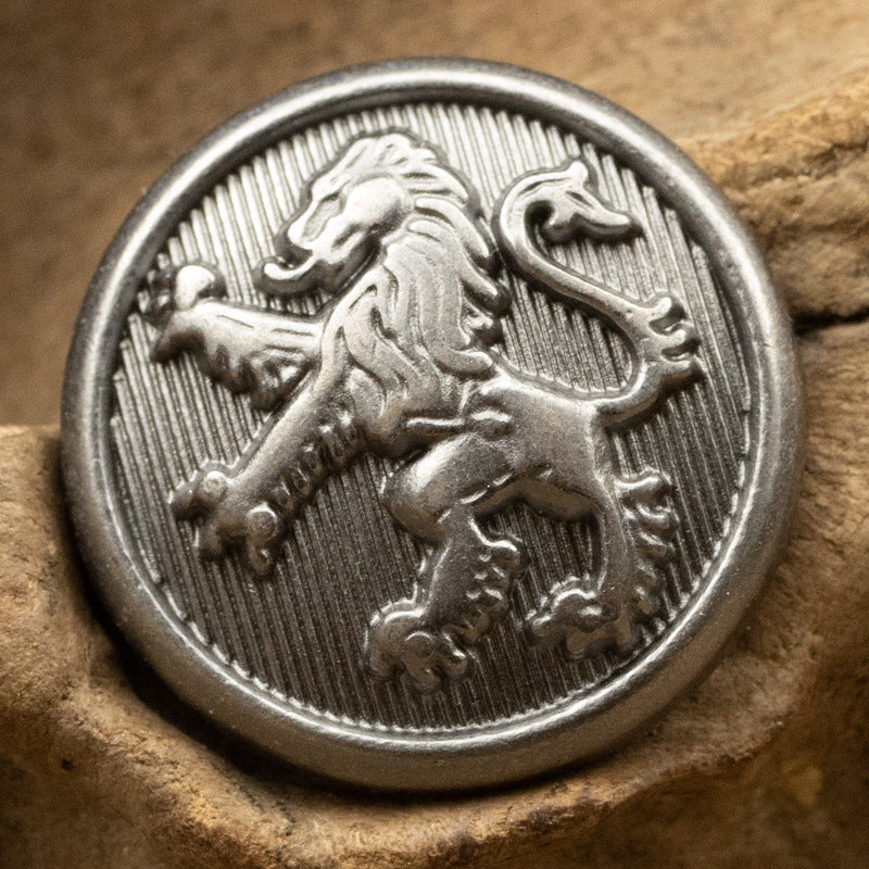 Lion face and mane metal shank button, black nickel finish, close view