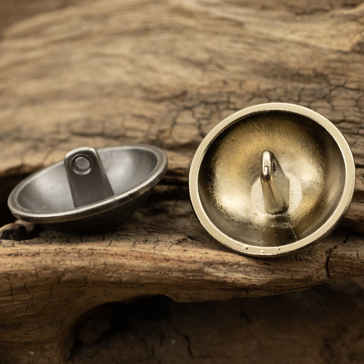 Gold mushroom-shank metal button with looped shank detail for denim jackets