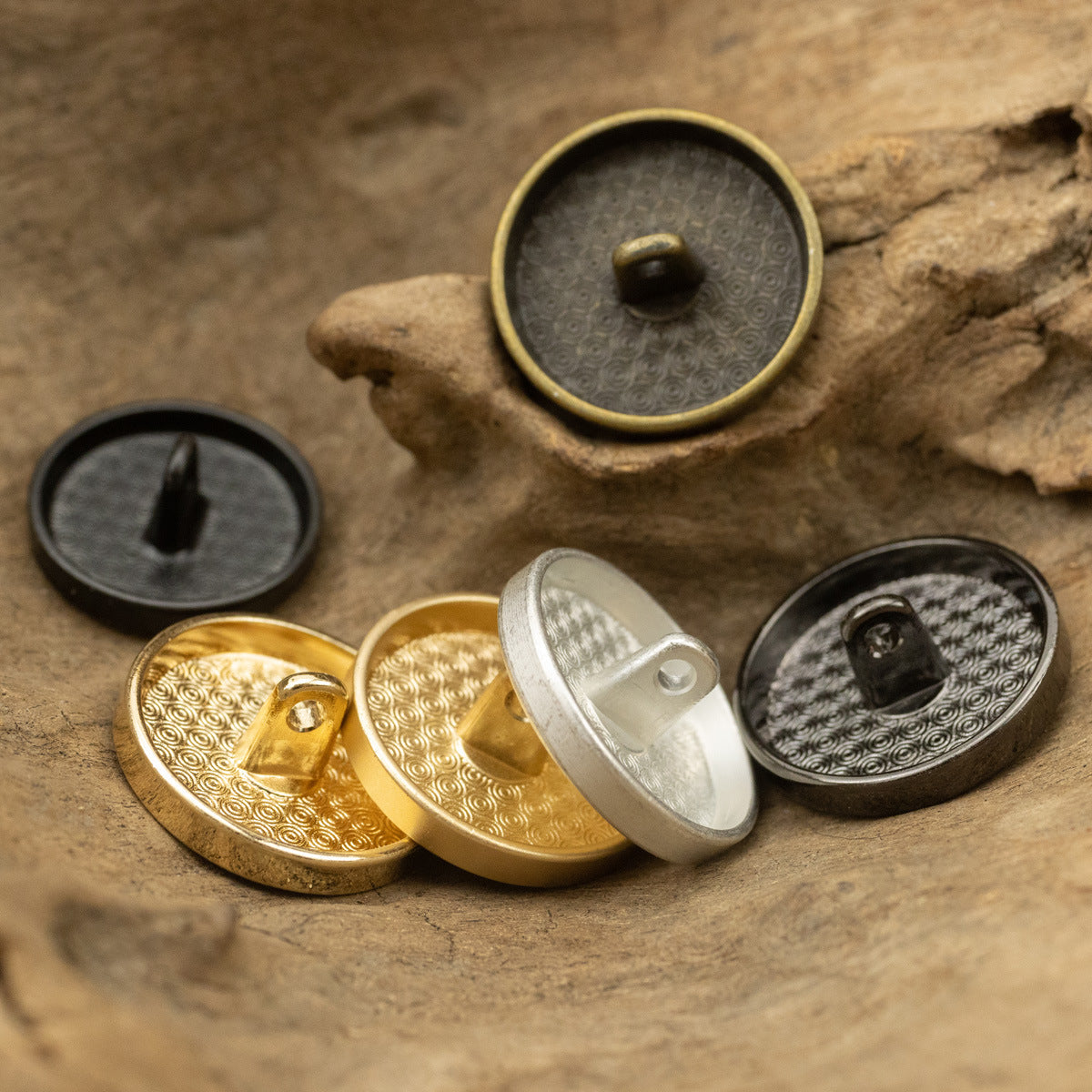 Round metal flat buttons with shank—backs show stems in gold, silver, bronze, and black