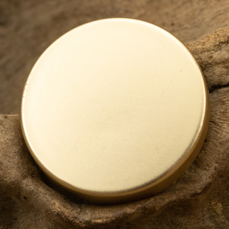 Round flat metal button with shank, polished silver-white