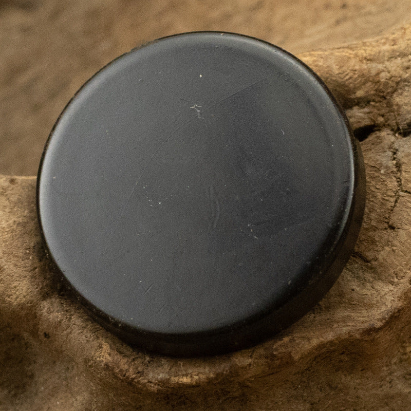 Round flat metal button with shank, matte black